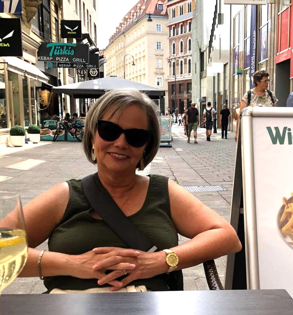 Elizabeth Jane Adams smiling on a European city street
